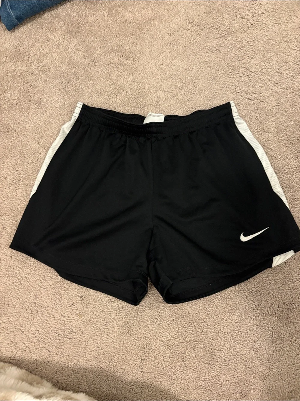 Nike Black Athletic Shorts with White Swoosh and Side Panels